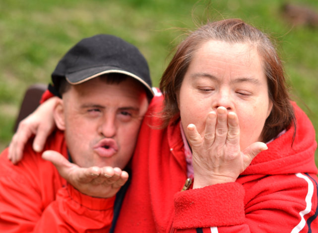 two people doing flying kiss