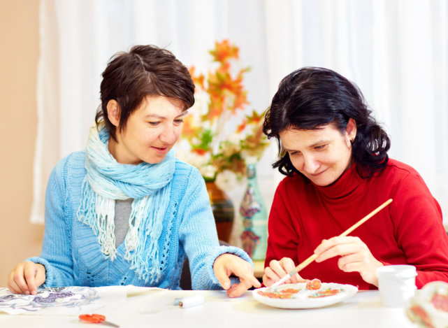 two women looking at their food